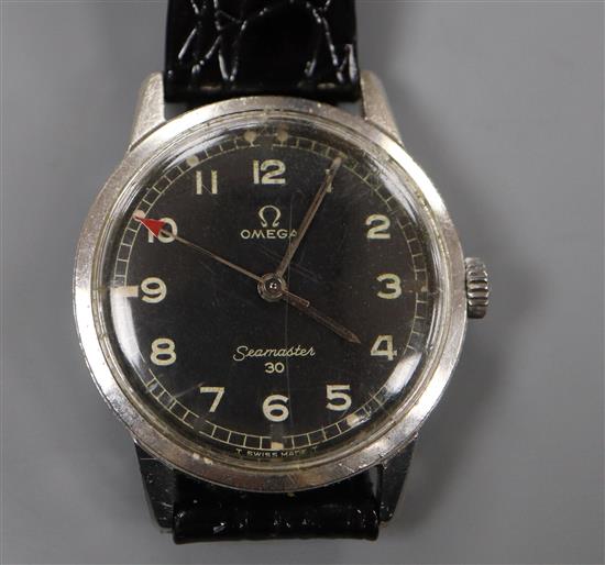 A gentlemans early 1960s stainless steel Omega Seamaster 30 manual wind wrist watch with military type black dial.